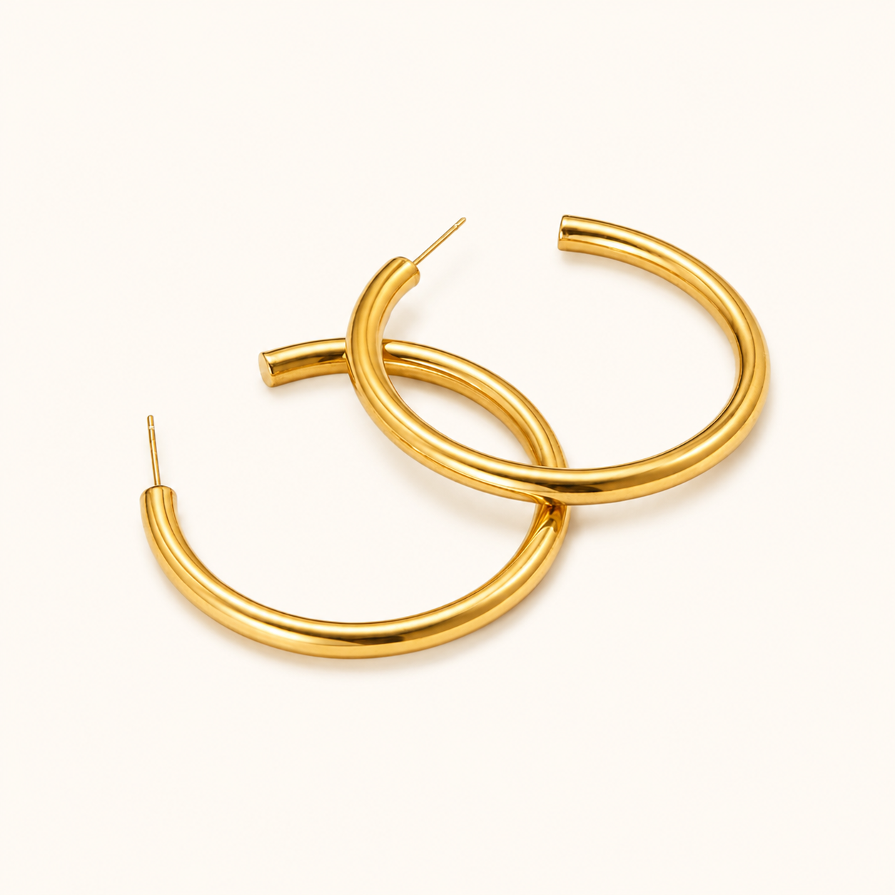 Gold hoop earrings on a white background